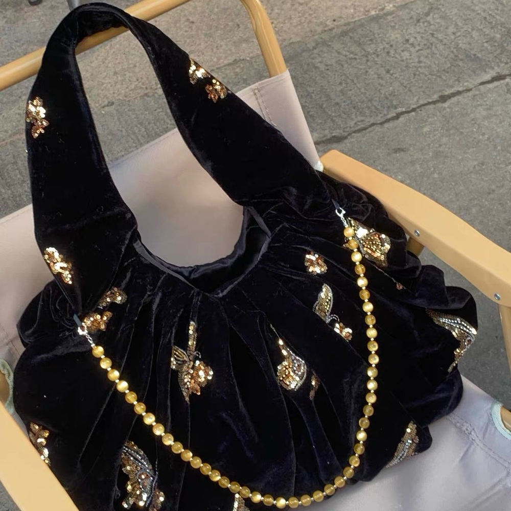 Elegant Black Velvet Bag with Gold Accents